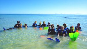 Students from Marine Classroom in the sea.