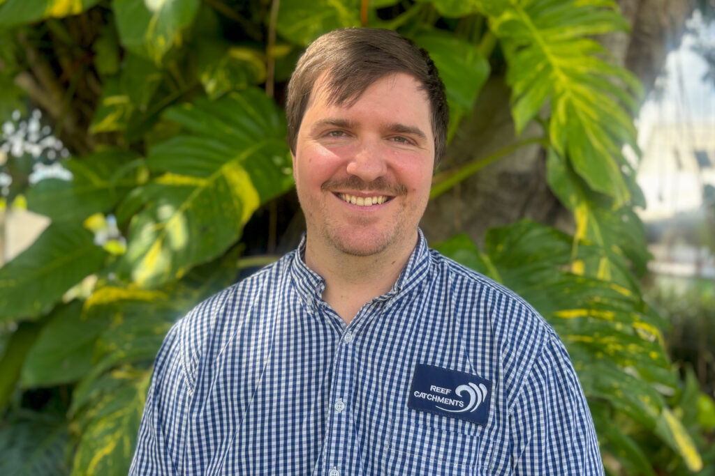 Sustainable Agriculture Manager Todd McNeill smiling in front of a tree