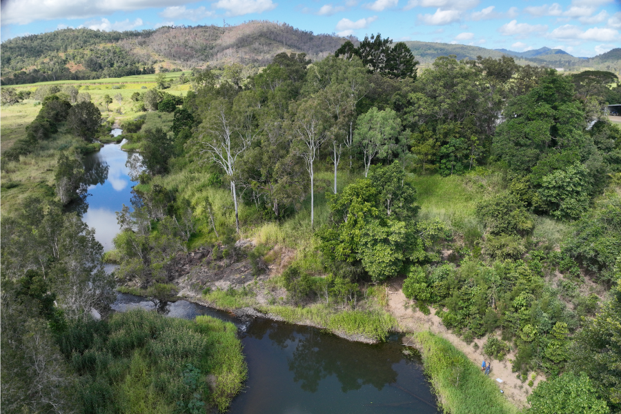 Aerial shot of waterway surrounded by bushland