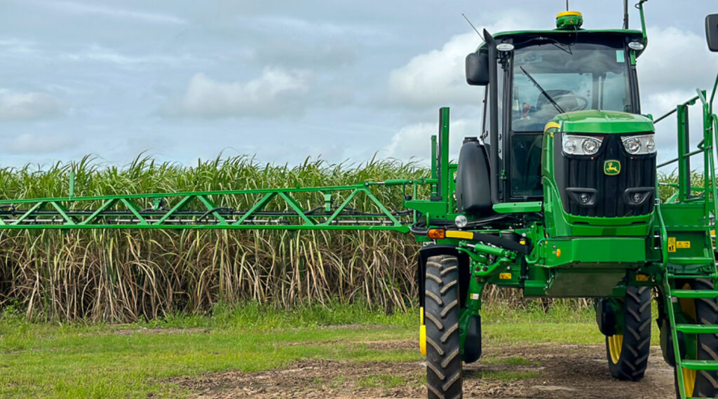 Spray rig tractor in cane field